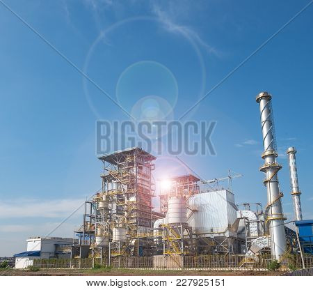 Biomass Power Plant And Blue Sky At Industrial Zone.