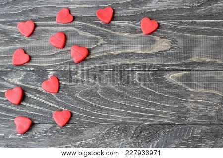 Valentine's Day . Red Hearts On A Wooden Background.