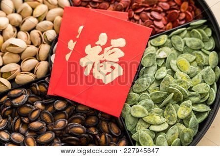 Trdaitional chinese snack tray with red paket word mean luck