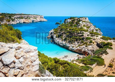 Calo Des Moro, Mallorca On A Sunny Day With People On The Beach