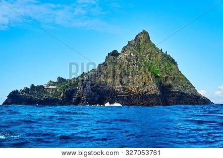Picturesque Skellig Michael Is A Steep Rocky Island-cliff Off The Atlantic Coast. County Kerry, Irel