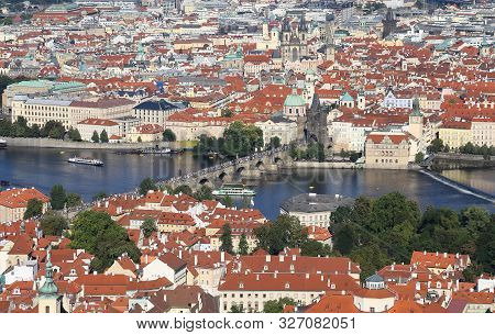 Panormamic View Of Prague City In Central Europe With Famous Charles Bridge On The Vltava River