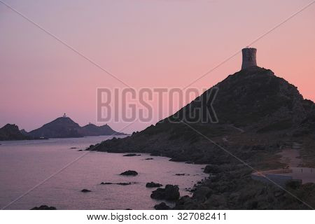 sunset on the Archipel des Sanguinaires that means Bloody Islands in french language on Corsica France with a turret on top