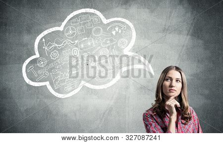 Serious Woman Looks Pensive Upwards And Thinking Something. Speech Bubble Full Of Business Diagrams 
