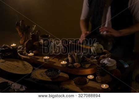 Man Playing Tank Drum Or Hang At Home. Warm Romantic Illumination, Low Key. Relaxation, Meditative A