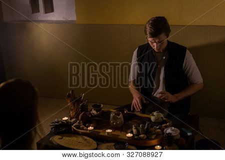 Man Playing Tank Drum Or Hang At Home. Warm Romantic Illumination, Low Key. Relaxation, Meditative A