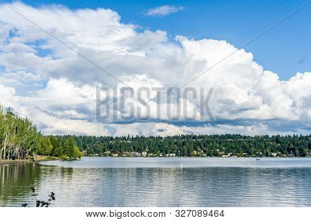 Billowing Clouds Hover Over Mercer Island In Washington State.