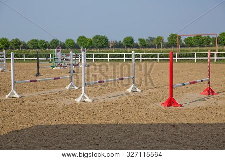 Image Of Show Jumping Poles On The Training Field. Wooden Barriers For Jumping Horses As A Backgroun