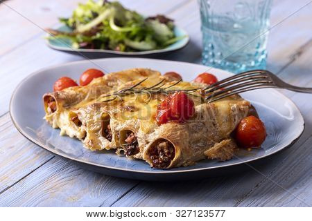 Six Italian Canneloni Pasta Rolls On Wood