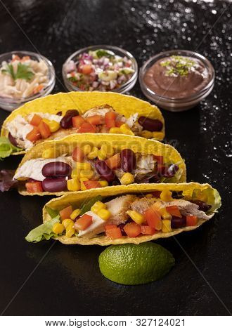 Closeup Of Three Mexican Tacos On Slate