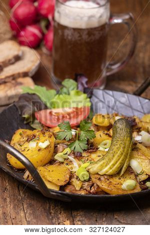 Rustic Tyrolean Groestl On Wood With Beer