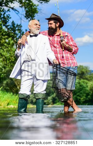 Fishing As Holiday. Hobby And Recreation. Fisherman In Formal Suit. Successful Catch. Friends Fishin