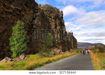 PINGVELLIR, 10 SEPTEMBER, 2019: Tourists enjoying the autumn landscape in Pingvellir National Park, Iceland, Europe