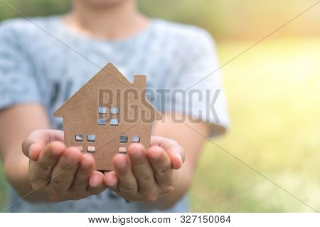 Copyspace Model Of A Little House That Woman Holds It Background.