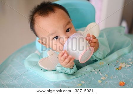 Asian Baby Boy 7 Months Old Eating With Baby Led Weaning (blw) Method, Self-feeding
