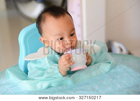 Asian Baby Boy 7 Months Old Eating With Baby Led Weaning (blw) Method, Self-feeding