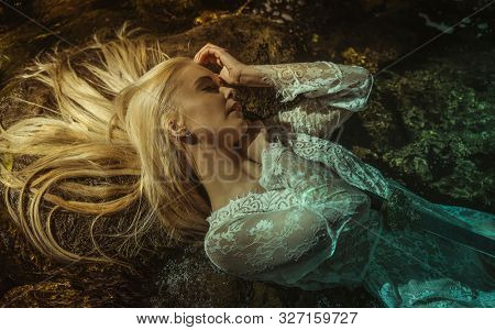 woman lying on the river, the legend of lady of the lake, beautiful woman with sword in white lace underwear, fantasy image