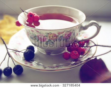 Autumn Tea. Cup Of Tea With Rowanberry.