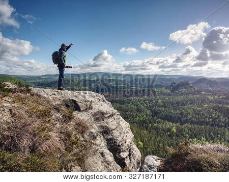 Travel Photographer On Mountain Summit Works. Man Like To Travel And Photography Taking Pictures Of 