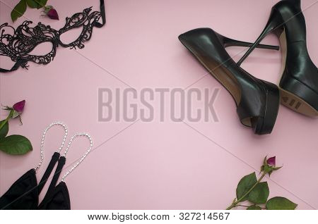 Black Dress, Mask, High Heel Shoes, Three Rose Buds On A Pink Background Copy Space