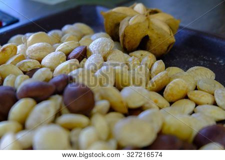 Sacha Inchi Peanuts Or Inca Seeds On A Tray. Sacha Inchi Has Cosmetic Qualities.