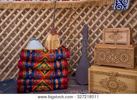Wooden Dowry Chest Near Some Asian Carpets