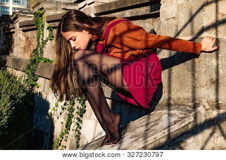 Shopping Inspiration. Atractive Dreamy Thoughtful Brunette Sitting Without Shoes. Thinking About Gir