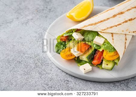 Wrap Sandwich, Roll With Fish Salmon, Vegetables And Cheese. Grey Background. Close Up.