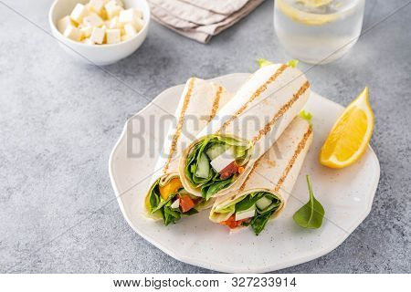Wrap Sandwich, Roll With Fish Salmon, Vegetables And Cheese. Grey Background. Close Up.