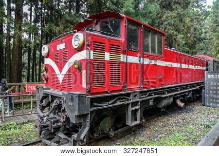Alishan,taiwan-october 14,2018:red Train Stop In Foggy Day At Alishan Train Station On Alishan Mount