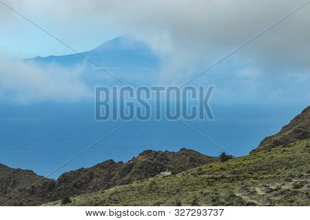 View Of Tenerife Through Low Clouds. Parque Natural Majona. Northeastern Part Of La Gomera Island. O