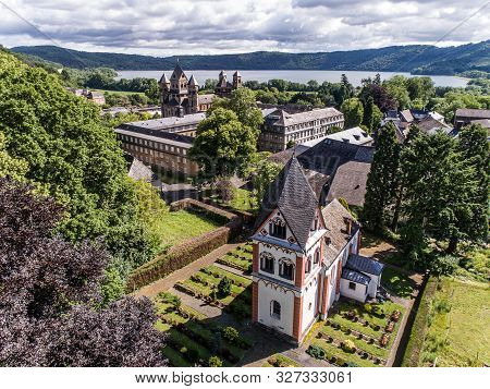 Aerial View On Laacher See Behind The Famous Abbey Maria Laach In Rhineland-palatinate, Germany