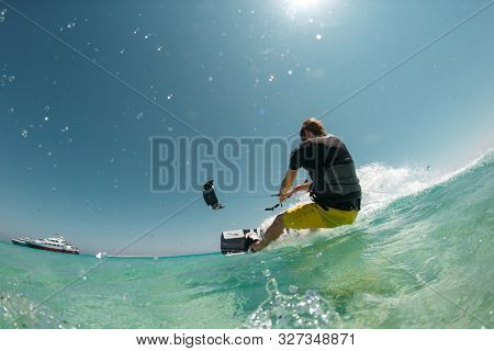 Kitesurfing on the waves of the sea in Mui Ne beach, Phan Thiet, Binh Thuan, Vietnam. Kitesurfing, Kiteboarding action photos Kitesurfer In action