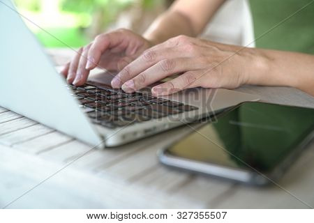 Woman's Hands Busy Typing On Keyboard. Flexi Work Concept.