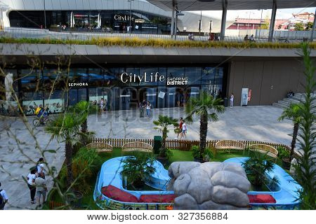 Milan, Italy - 07.14.2019: Entrance Of The Citylife Shopping Center At The Bottom Of The Three Tower