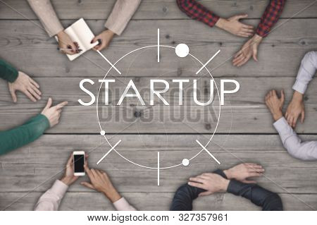 Top View Of Six People Working And Startup Business Concept