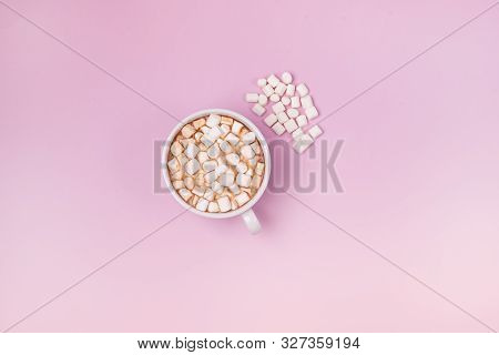 White Cup Of Hot Chocolate Cocoa With Marshmellows On Pink Background Marshmellow Are Lying On Pin B