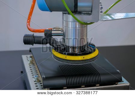 Pick And Place Robotic Arm Manipulator Moves Black Parts Of Computer Device At Modern Robot Exhibiti