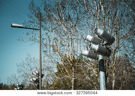 Four Powerful Spotlights Directed Upwards As A Part Of Landscape Lighting Equipment Installation Out