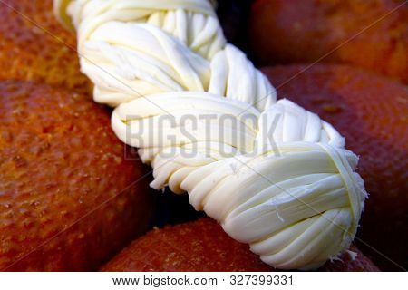 National Homemade Circassian Cheese, On The Table, Close-up. White Cheese Pigtail