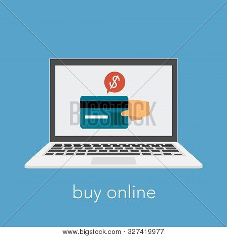 Buy Online Slogan With Laptop And Credit Card. A Hand Making Payment