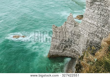 West Coast Of France. Étretat. Great View From A Great Height. The Sea Beats Against Rocks And Stone