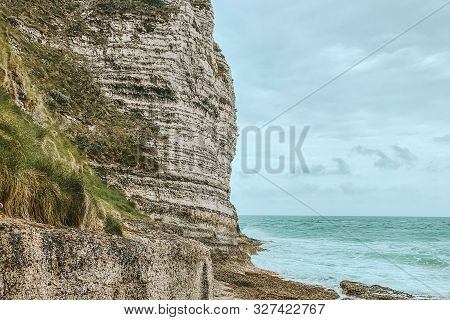 West Coast Of France. Étretat. Great View From A Great Height. The Sea Beats Against Rocks And Stone
