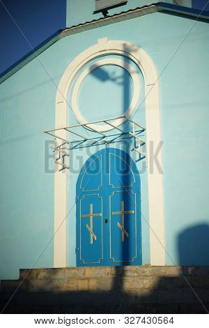 Closed Blue Arched Doors To The Orthodox Church.