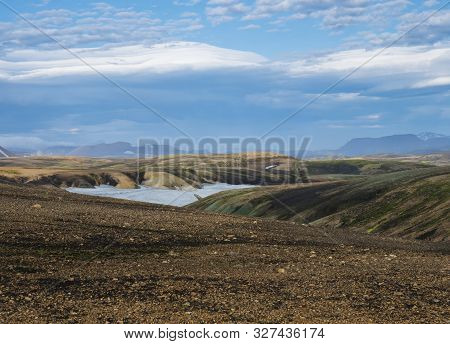 Colorful Rhyolit Mountain Panorma With Snow Fiields And Multicolored Volcanos In Landmannalaugar Are