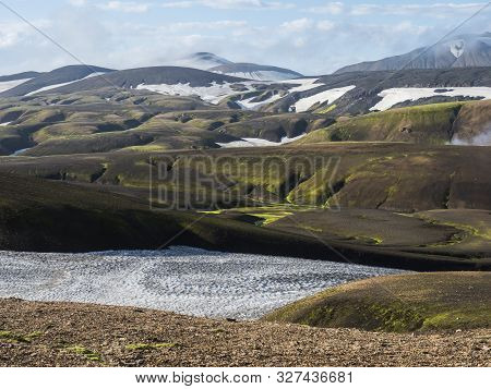 Landmannalaugar Colorful Rhyolit Mountains With Snow Fiields On Famous Laugavegur Trek. Fjallabak Na