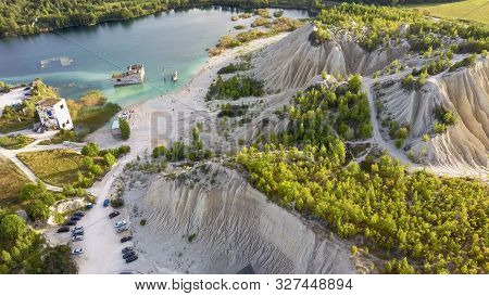 Sand Hills Of Quarry With A Pond And Abandoned Prison In Rummu Estonia Europe. Flooded Houses Of For