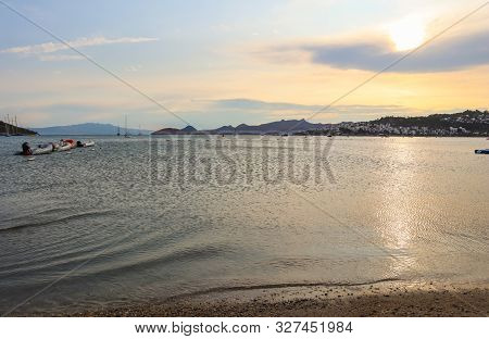 Beautiful Sunset On Mediterranean Coast With Islands And Mountains, Boats And Catamarans
