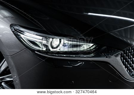 Novosibirsk, Russia - October 04, 2019:  Mazda 6,black Car Headlights. Exterior Detail. Close Up Det