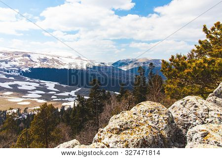 Lago Naki Spring Plateau With Snowy Hills, Blue Sky And Clouds